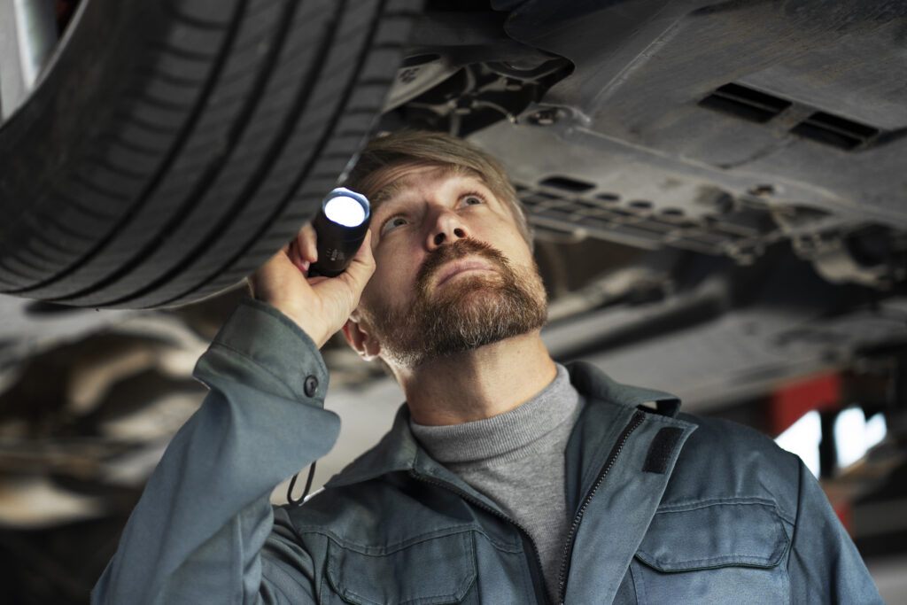 medium-shot-man-checking-car